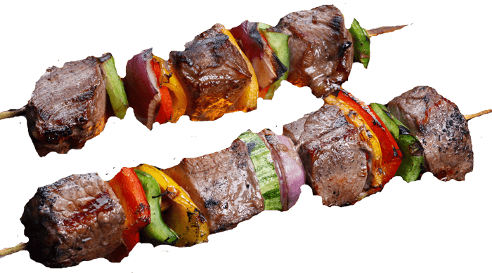 vegetable and meat skewers on grill
