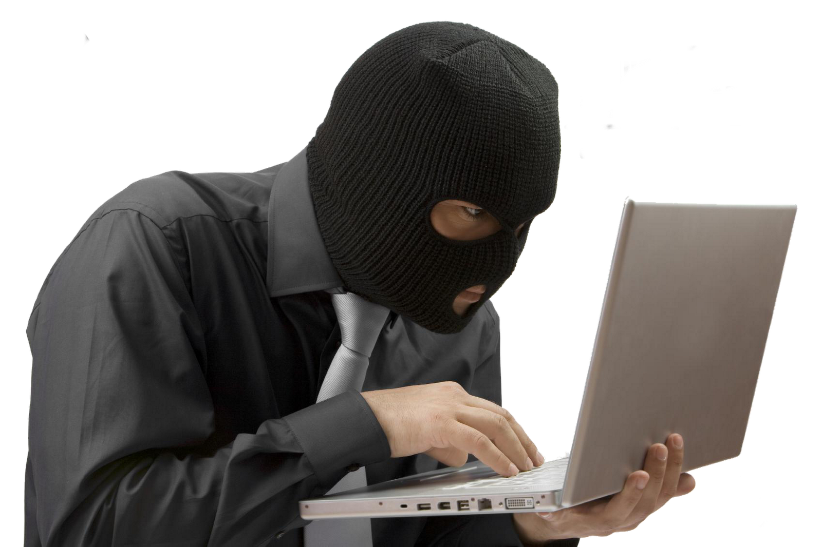 Masked Hacker Typing on Silver Laptop