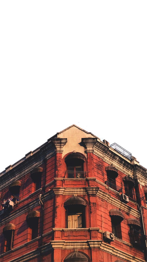 Red Brick Corner Building with Arched Windows