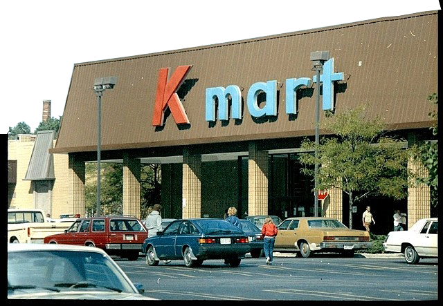 Buildings s group of car park beside K mart building transparent background PNG free download