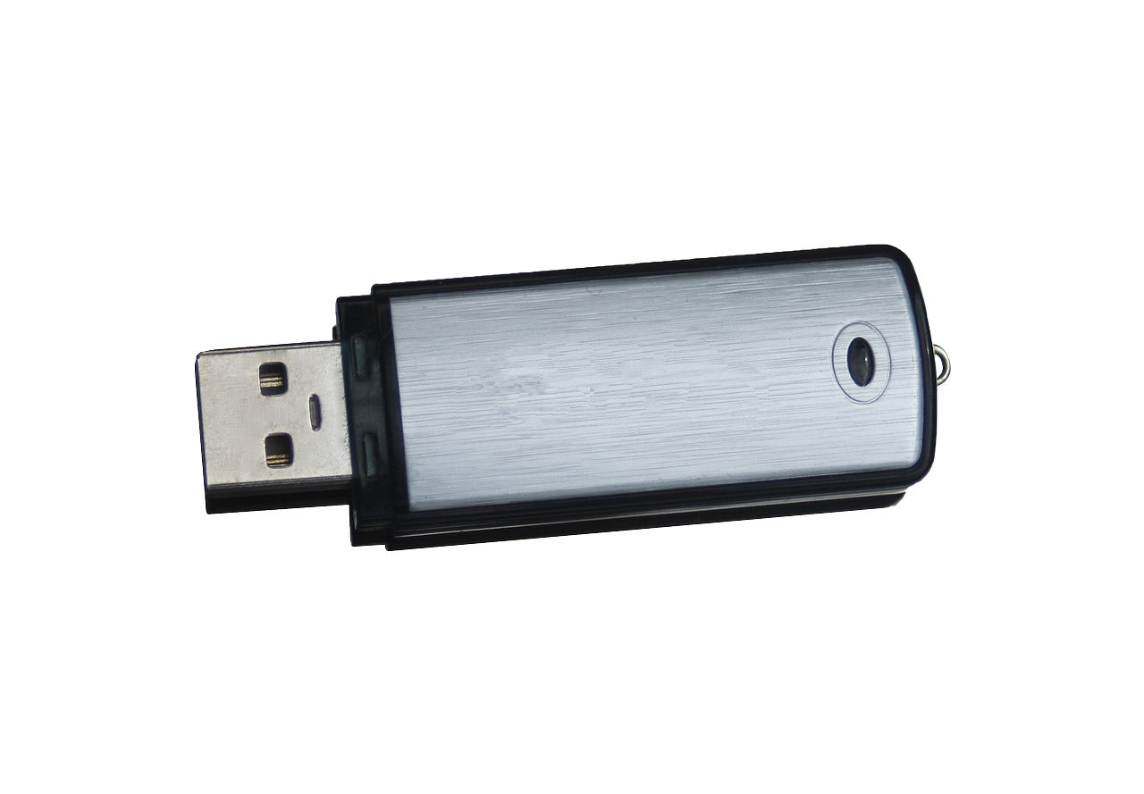 Black Compact USB Flash Drive With Silver Connector And Rounded Case PNG Photo