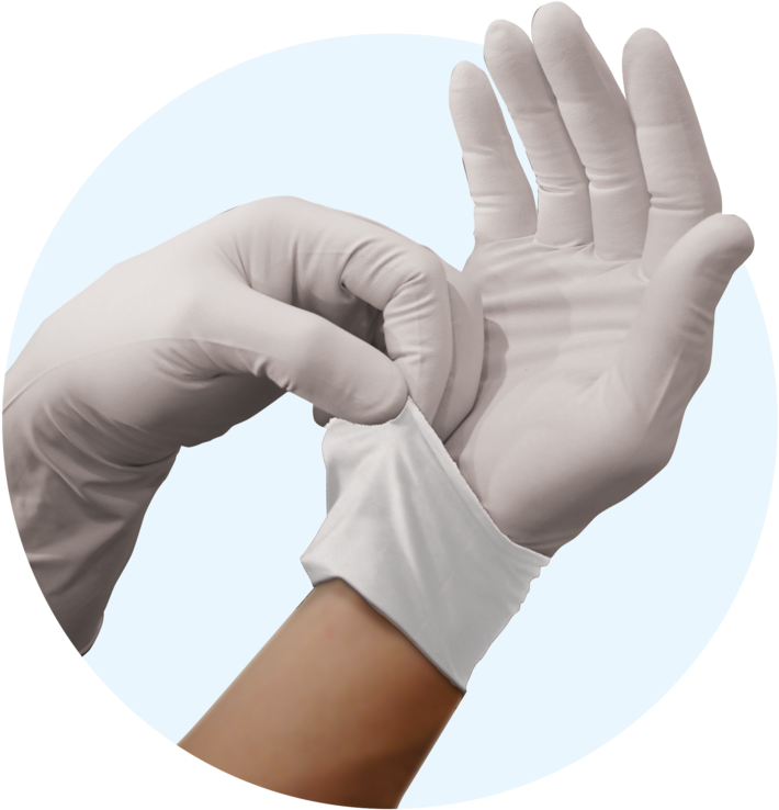 Close Up Of White Medical Glove Cuff Being Pulled On Blue Circle Background