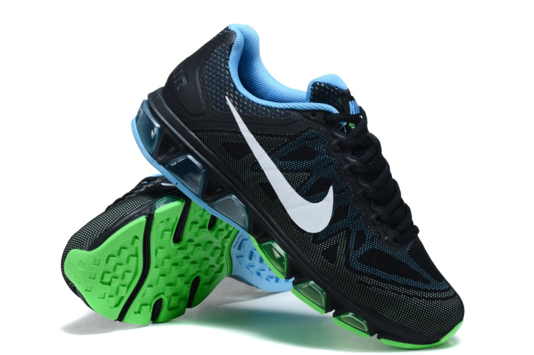 Pair Of Black Blue And Green Nike Athletic Shoes With Grip Soles PNG
