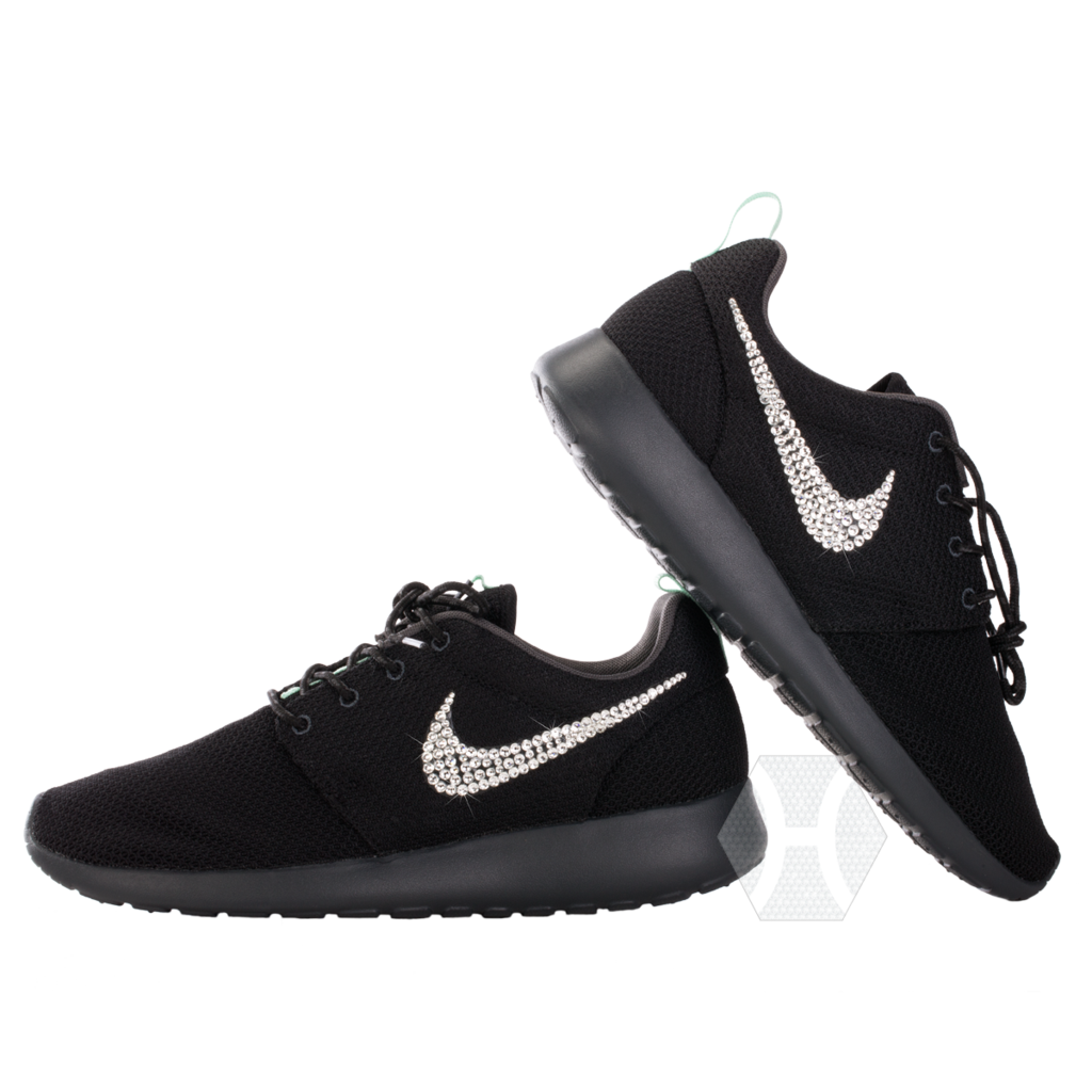 Pair Of Black Nike Running Shoes With White Swoosh Logos PNG