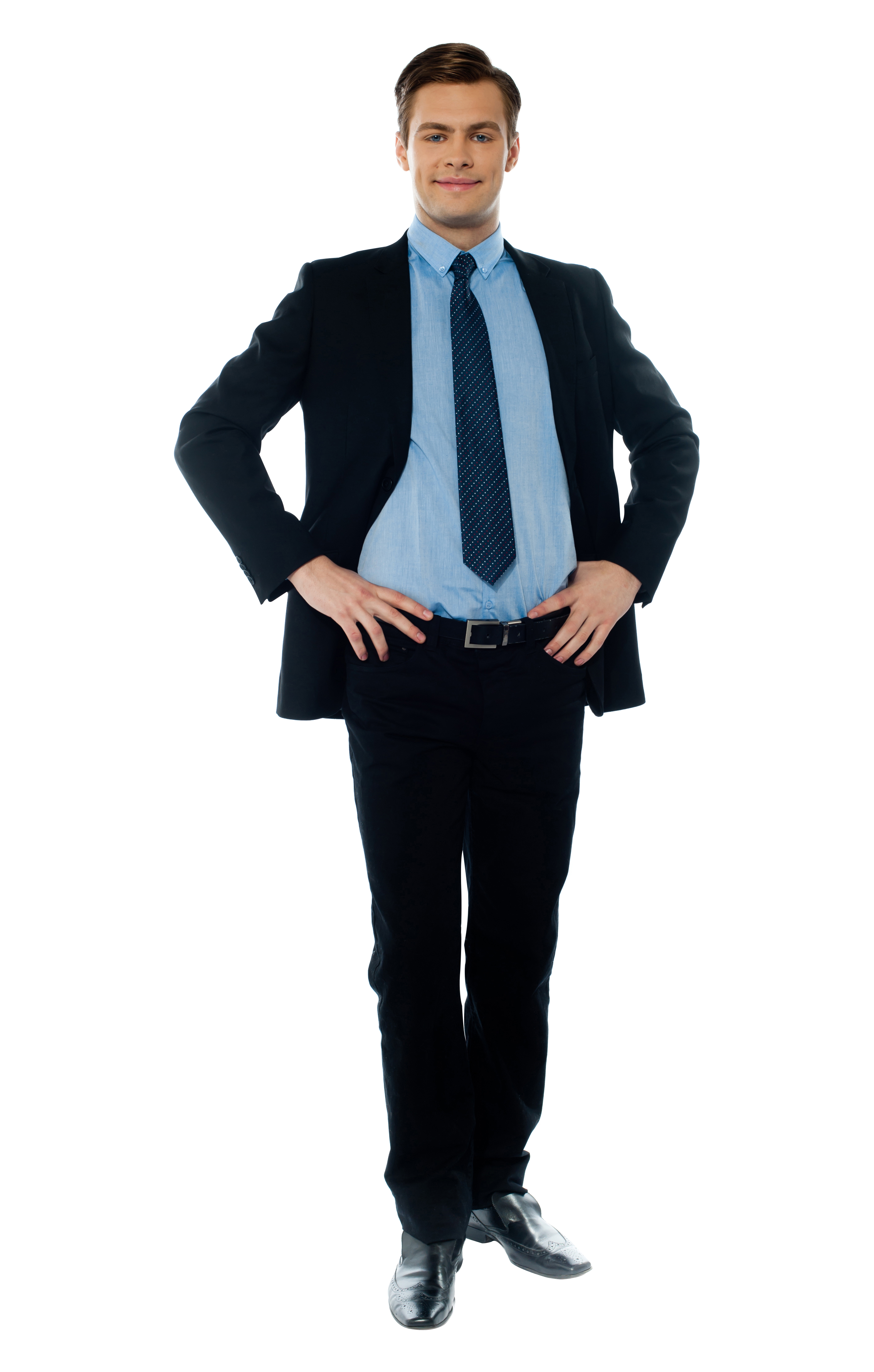 Businessman In Dark Suit With Blue Shirt And Tie Standing Confidently