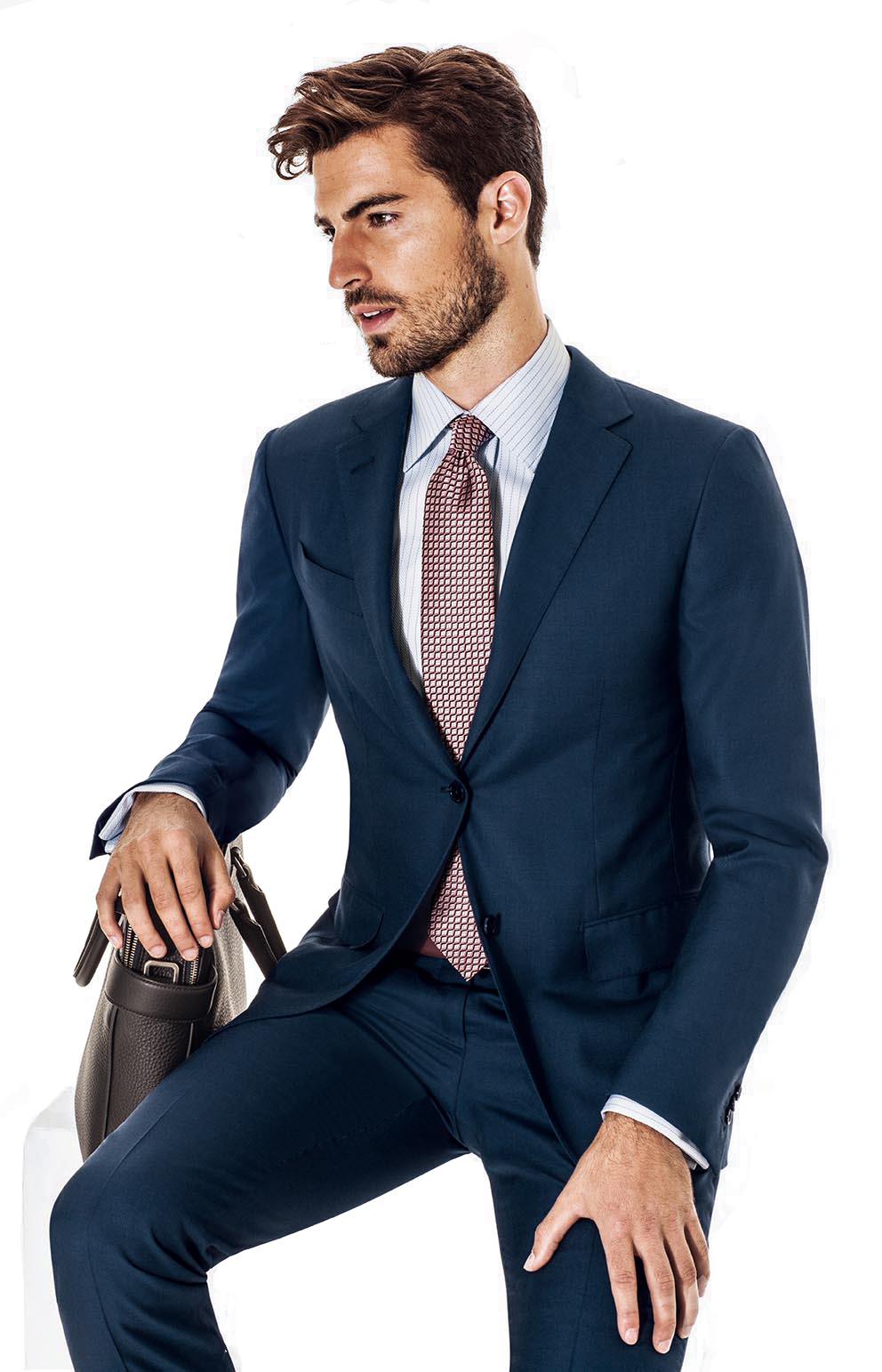 Man Sitting In Navy Suit With Pink Tie And Brown Dress Shoes