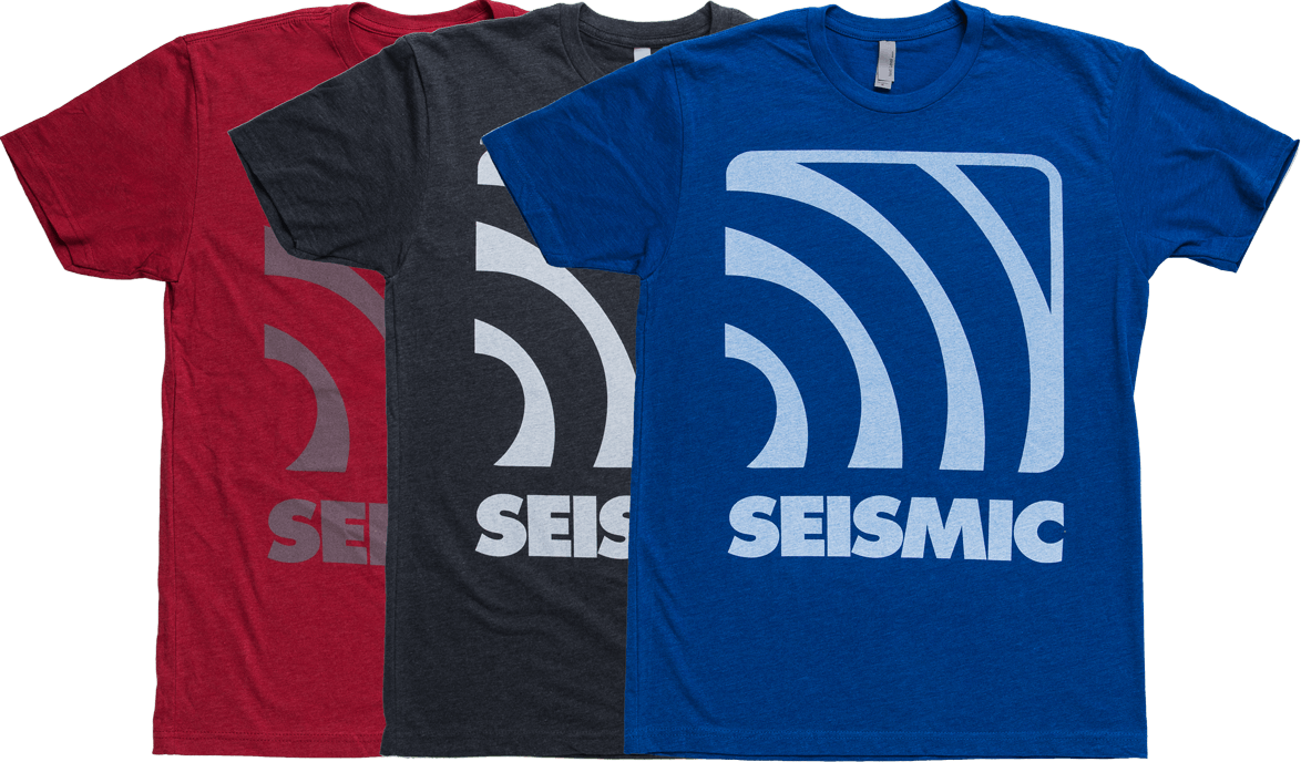 Three Seismic Logo T Shirts In Red Charcoal And Blue PNG Graphic