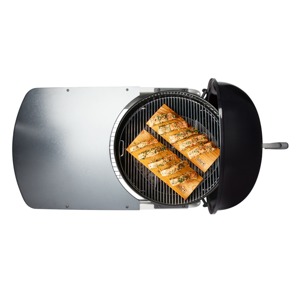 Black Round Grill With Grilled Fish Fillets And Open Side Lid PNG Product