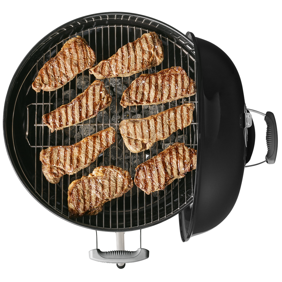 Round Indoor Grill Pan With Several Steaks Cooking On Surface PNG