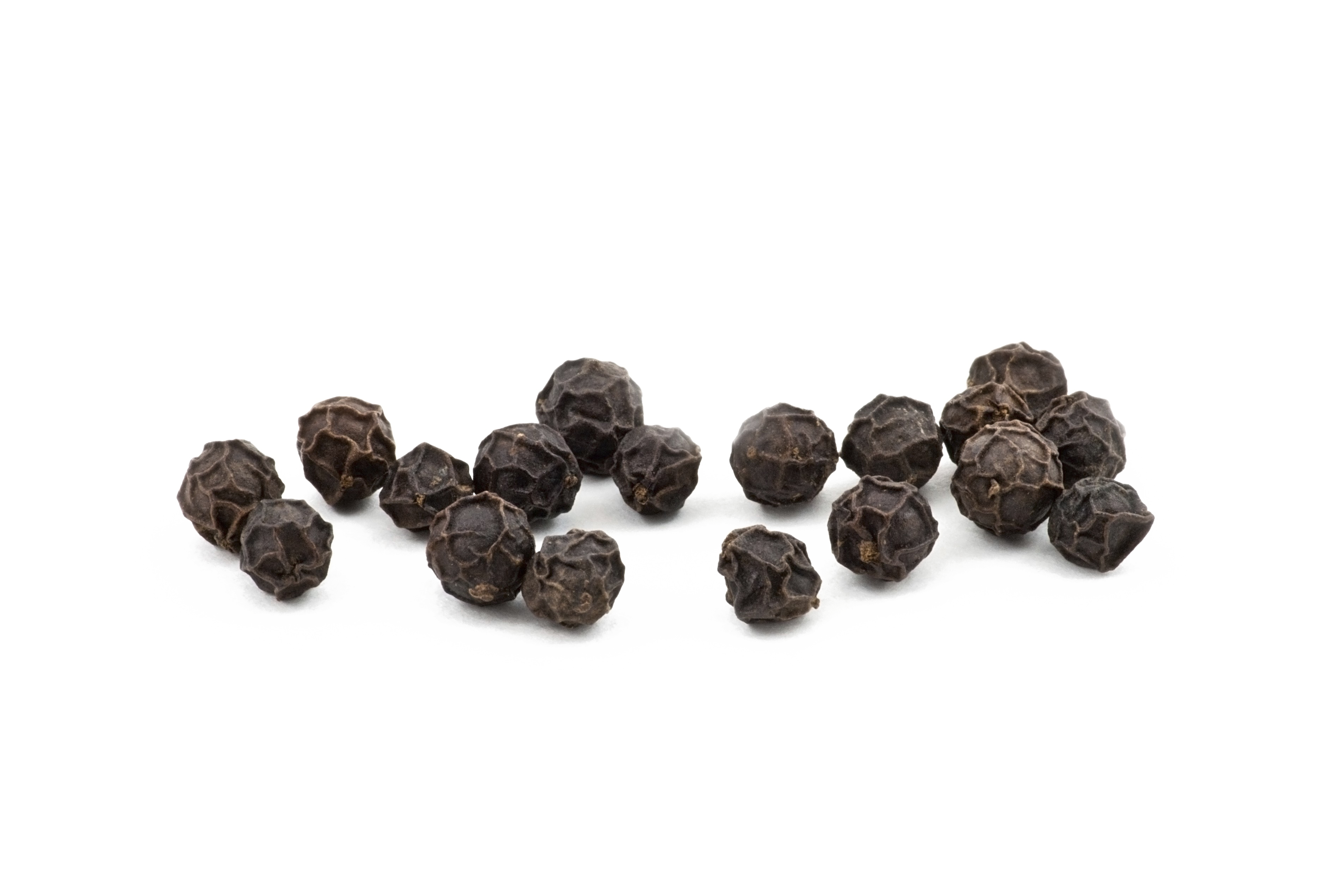 Small Cluster Of Whole Black Peppercorns With Scattered Spice PNG