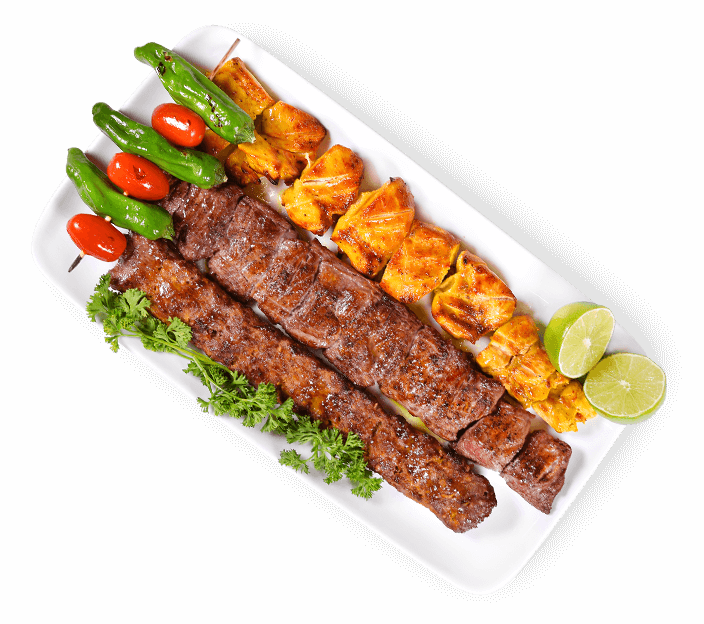 Grilled Meat Kebab Skewers with Peppers and Greens on White Plate PNG Image