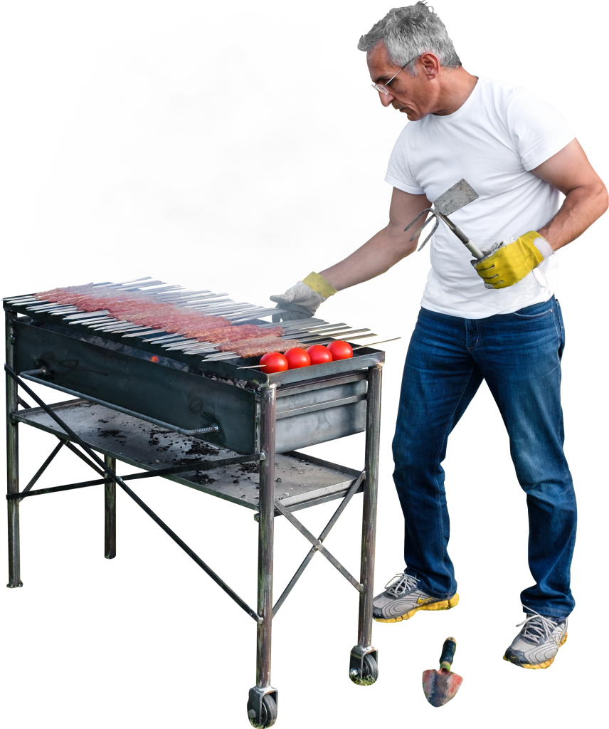 Street Food Chef Grilling Kebabs at Outdoor Charcoal Barbecue PNG Photo
