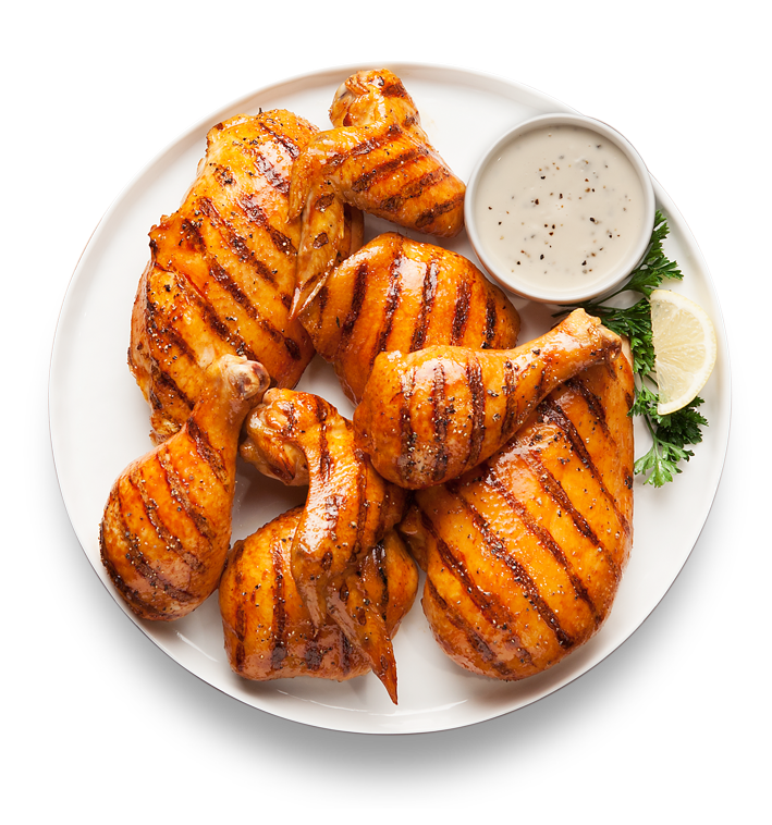 Grilled Chicken Wings with Char Marks and Lime on White Plate PNG Food Image