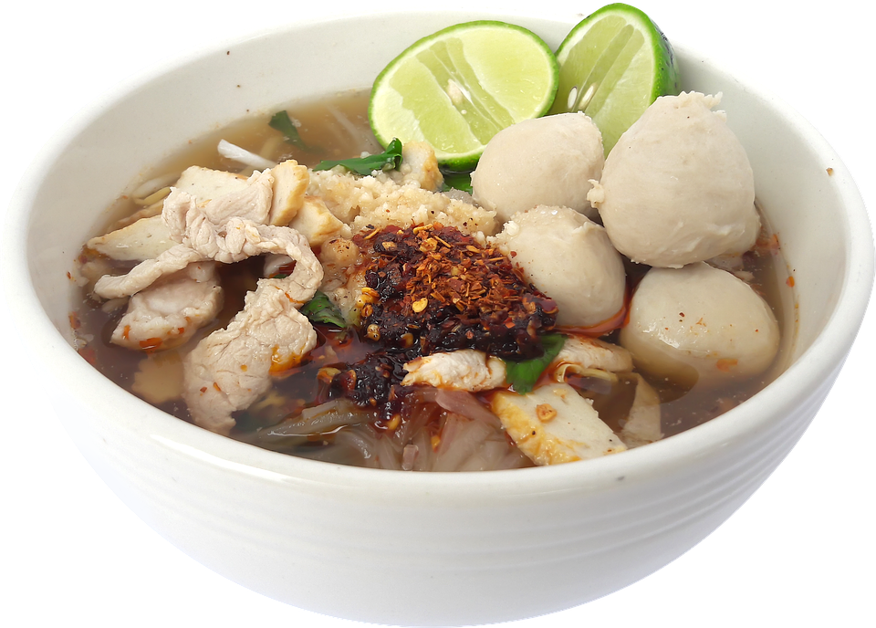 Clear Noodle Soup with Meatballs and Lime Wedge in White Bowl PNG Photo