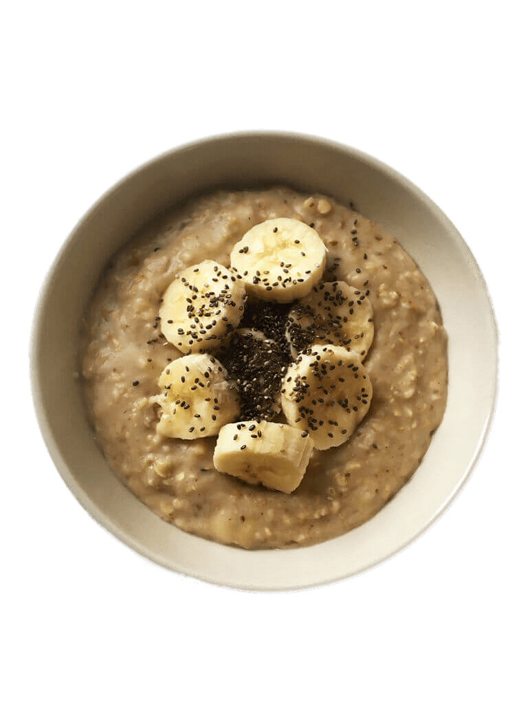 Warm Oatmeal Bowl Topped with Cashews and Banana Slices PNG Breakfast Photo