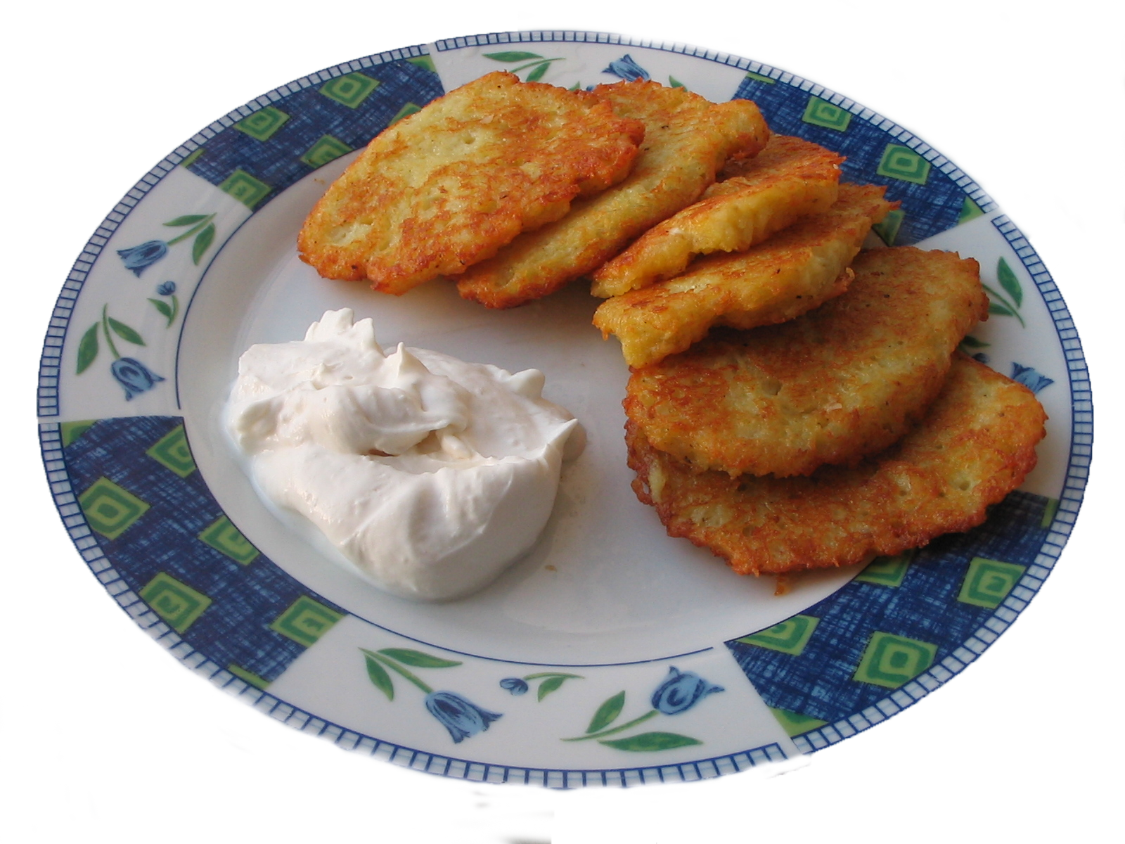 Golden Savory Fritters with Sour Cream on Blue Patterned Plate PNG Image