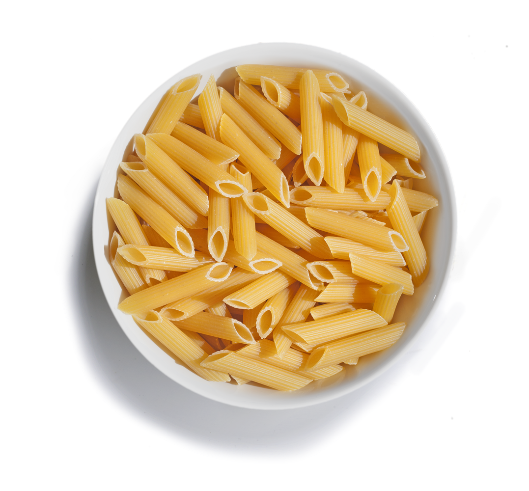 Uncooked Penne Pasta Served on White Plate Isolated PNG Food Image