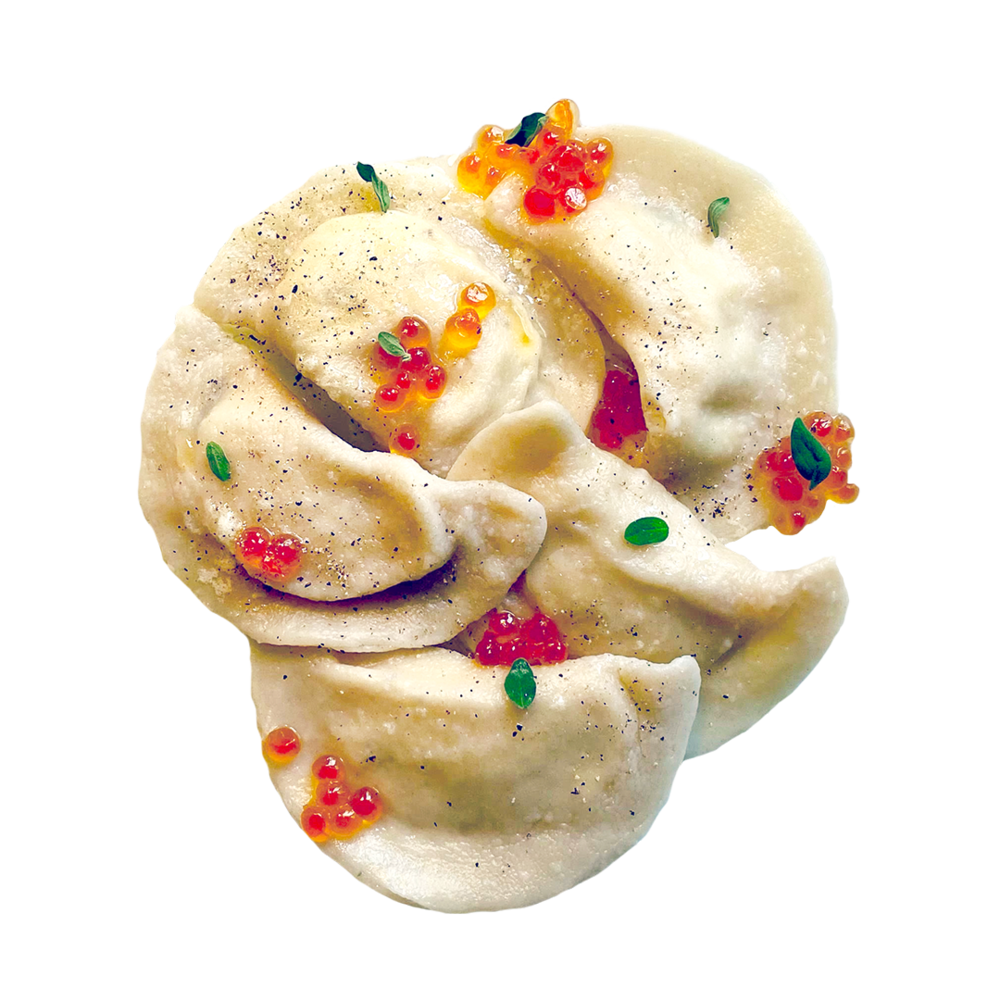Creamy Pierogi Dumplings with Colorful Vegetable Garnish PNG Food Image