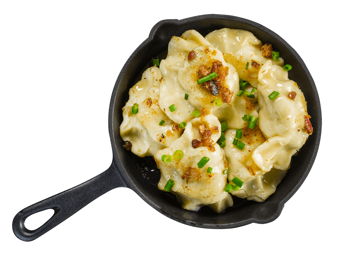 Creamy Pierogi Dumplings with Green Onion in Black Skillet PNG Image