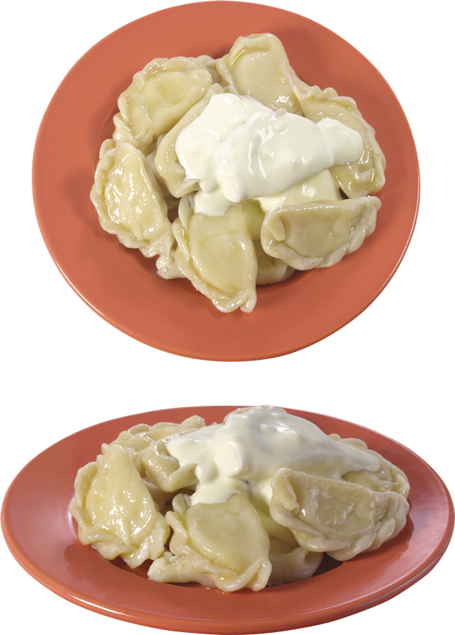 Two Plates of Pierogi Topped with Sour Cream and Cucumber Slices PNG Image