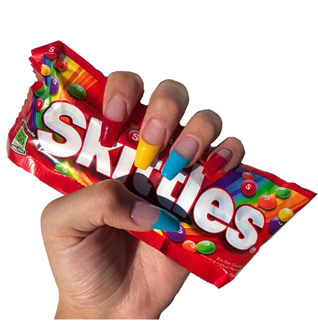 Hand Holding Several Skittles Candy Packets with Rainbow Branding PNG Image