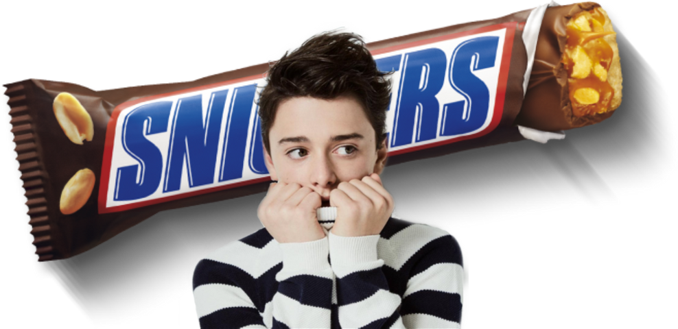 Man Reacting in Front of Oversized Snickers Chocolate Bar PNG Promotional Graphic