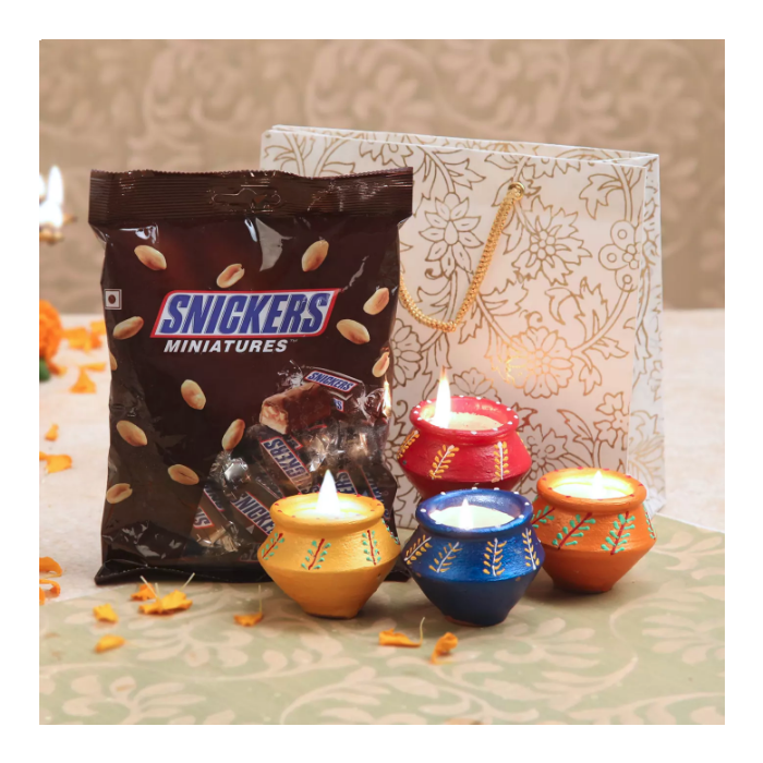 Snickers Chocolate Bar Still Life with Candy Packaging and Dessert Props PNG Image