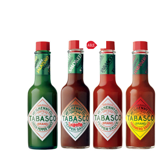 Assorted Tabasco Hot Sauce Bottles in Multiple Flavors PNG Product Lineup