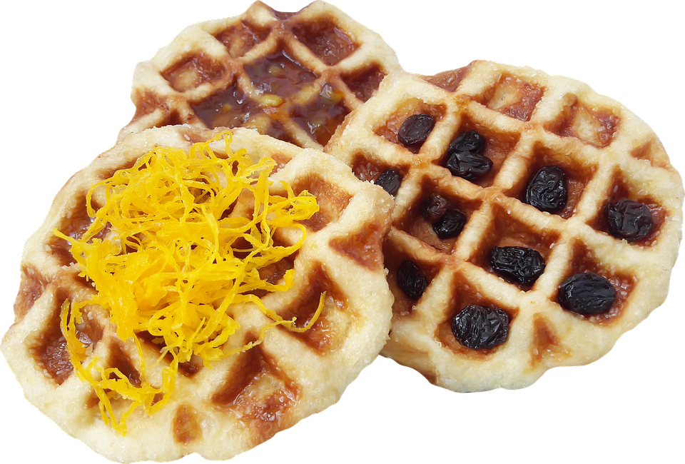 Savory Waffle Pieces Topped with Shredded Cheese on White Plate PNG
